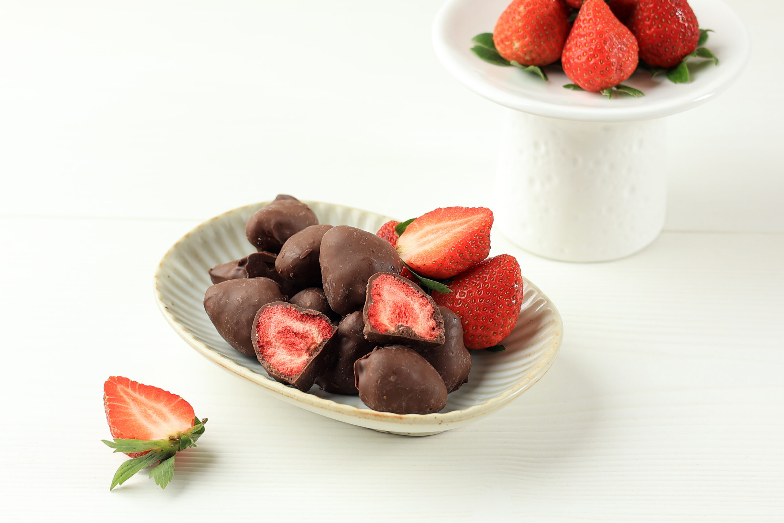 Dried Strawberry Coated with Chocolate on White Table